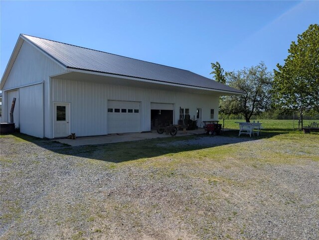 15916 Airport Rd, Linesville, PA 16424 - view of property exterior featuring a detached garage, an outdoor structure, and metal roof