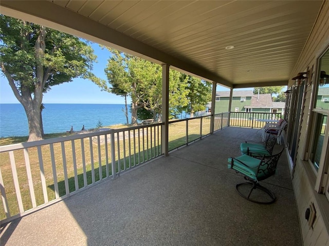 view of patio featuring a water view