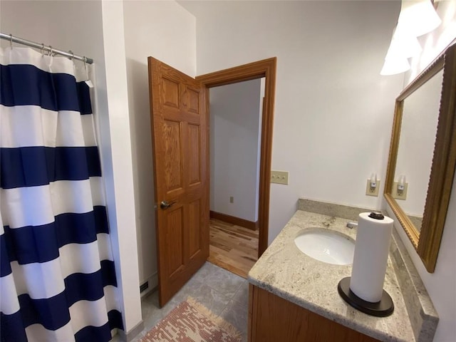 bathroom featuring a shower with curtain and vanity