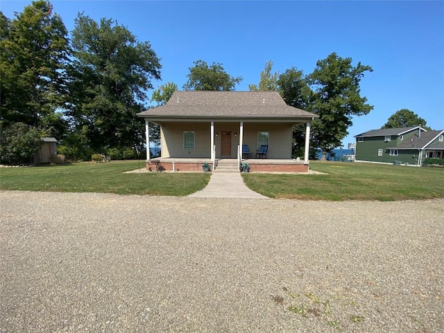 bungalow featuring a porch and a front yard