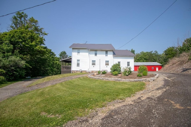 5499 Pinetree Rd, Mckean, PA 16426 - view of front of house with driveway, a front lawn, and a metal roof