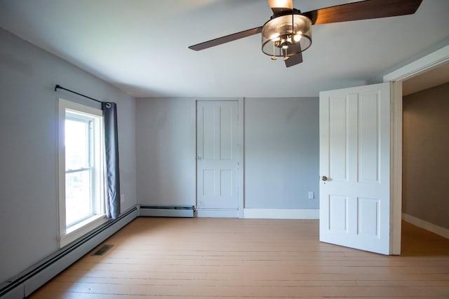 5499 Pinetree Rd, Mckean, PA 16426 - unfurnished bedroom with hardwood / wood-style floors, a baseboard heating unit, and ceiling fan