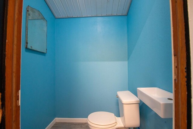 5499 Pinetree Rd, Mckean, PA 16426 - bathroom with toilet and baseboards