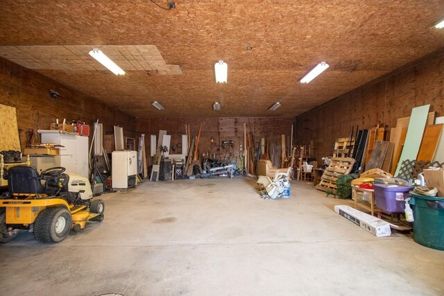 5499 Pinetree Rd, Mckean, PA 16426 - garage featuring wood walls