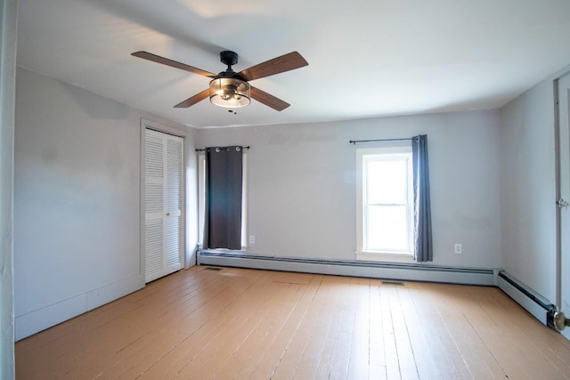 5499 Pinetree Rd, Mckean, PA 16426 - spare room featuring a ceiling fan, hardwood / wood-style flooring, and baseboard heating