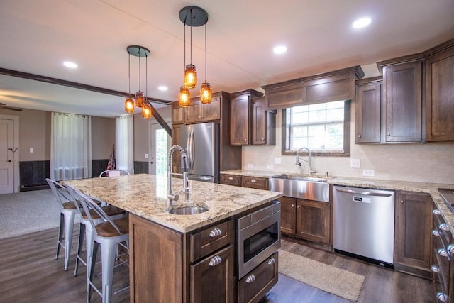 5499 Pinetree Rd, Mckean, PA 16426 - kitchen with appliances with stainless steel finishes, dark wood finished floors, a kitchen breakfast bar, plenty of natural light, and recessed lighting