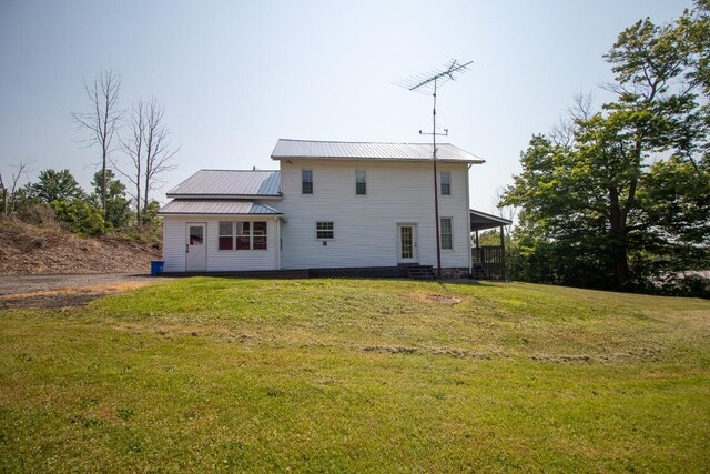5499 Pinetree Rd, Mckean, PA 16426 - rear view of house with a lawn and a metal roof