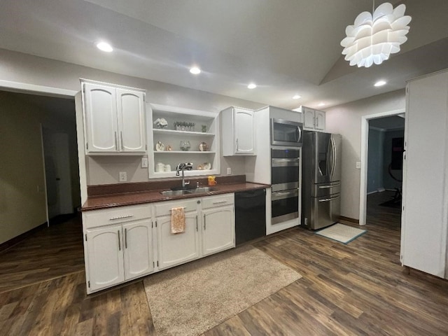 kitchen with white cabinets, stainless steel appliances, dark wood-type flooring, and sink