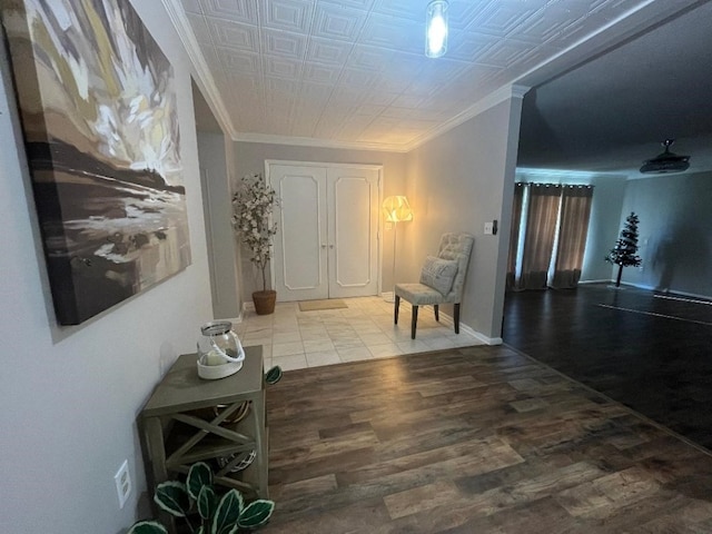 hall featuring hardwood / wood-style floors and ornamental molding