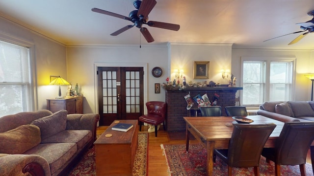 living room featuring french doors, ceiling fan, ornamental molding, and hardwood / wood-style floors