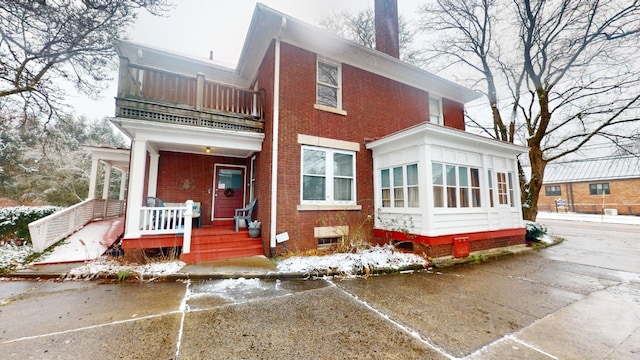 rear view of house with a balcony