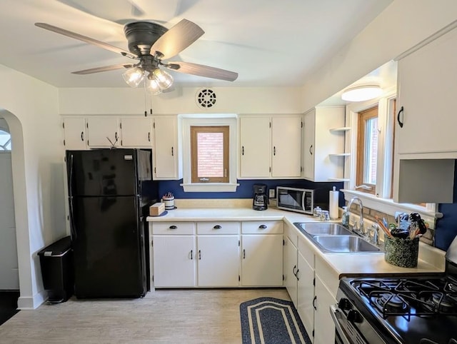 933 E 31st St, Erie, PA 16504 - kitchen with appliances with stainless steel finishes, healthy amount of natural light, white cabinetry, and light countertops