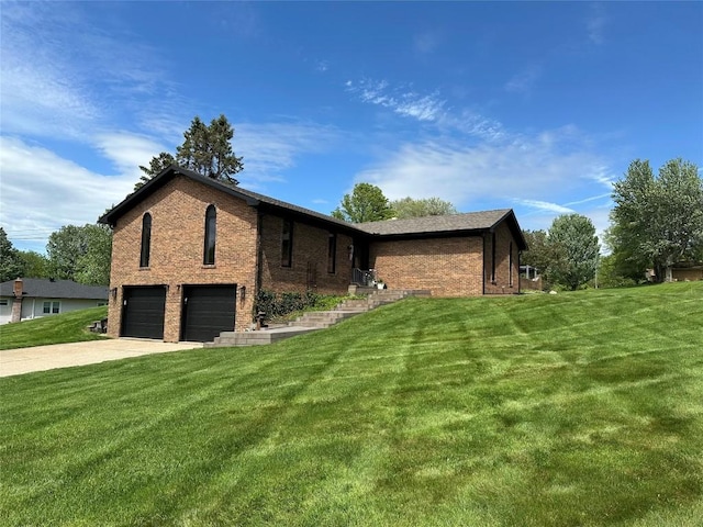 6170 Mistletoe Ave, Fairview, PA 16415 - view of property exterior with an attached garage, a yard, concrete driveway, and brick siding