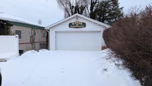 view of snow covered garage