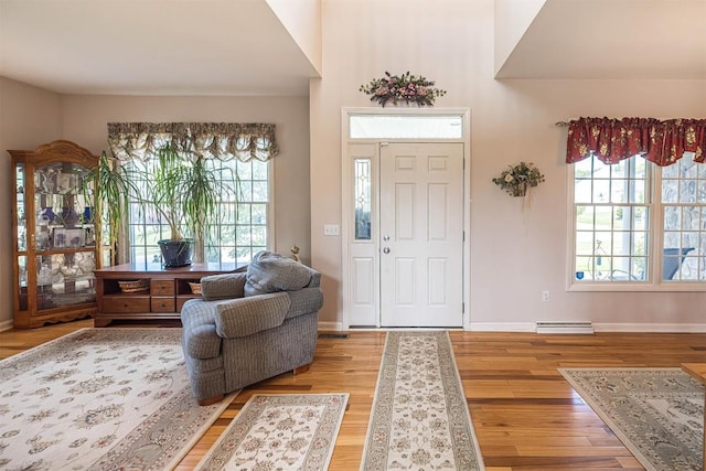 6018 Pebble Creek Dr, Fairview, PA 16415 - foyer entrance featuring wood finished floors, healthy amount of natural light, and baseboards