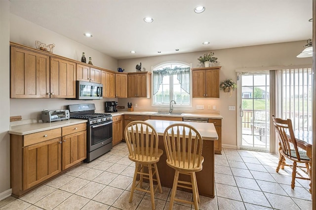 6018 Pebble Creek Dr, Fairview, PA 16415 - kitchen with appliances with stainless steel finishes, a sink, light countertops, light tile patterned floors, and recessed lighting