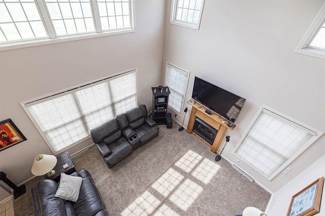 6018 Pebble Creek Dr, Fairview, PA 16415 - carpeted living area featuring a high ceiling and a glass covered fireplace