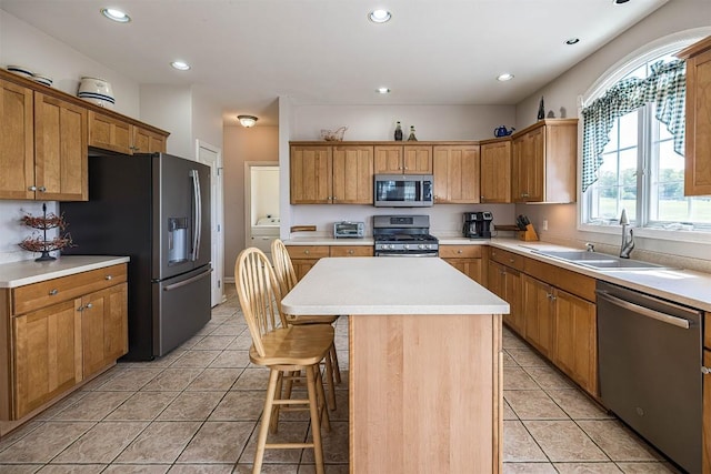 6018 Pebble Creek Dr, Fairview, PA 16415 - kitchen with stainless steel appliances, light tile patterned floors, a center island, a sink, and recessed lighting