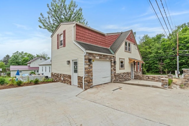 20527 Baird Rd, Meadville, PA 16335 - view of home's exterior featuring stone siding, a shingled roof, and driveway