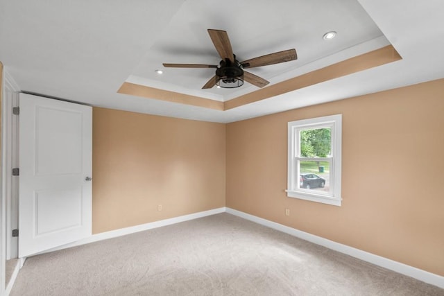 20527 Baird Rd, Meadville, PA 16335 - empty room featuring a tray ceiling, ceiling fan, light carpet, and recessed lighting