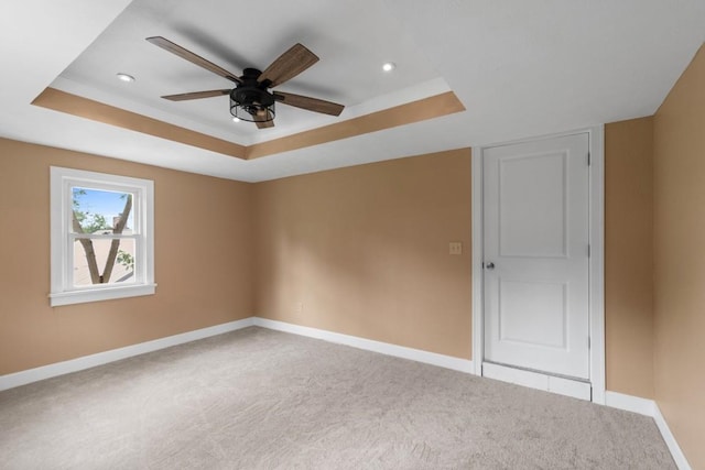 20527 Baird Rd, Meadville, PA 16335 - spare room with a raised ceiling, light colored carpet, ceiling fan, and recessed lighting