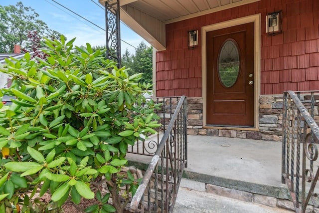 20527 Baird Rd, Meadville, PA 16335 - view of exterior entry with stone siding and a porch