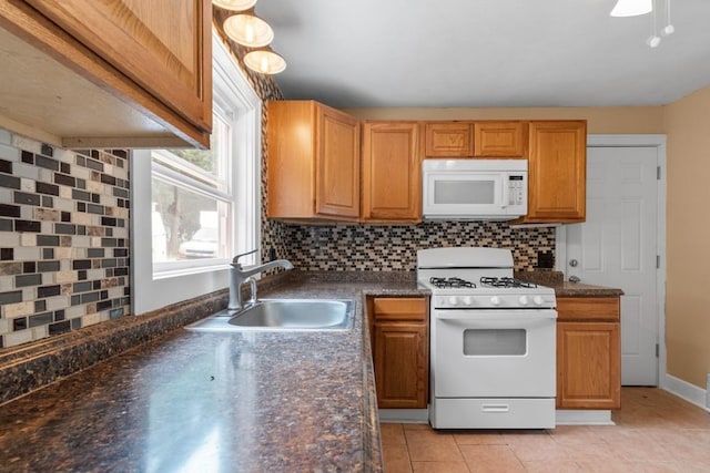 20527 Baird Rd, Meadville, PA 16335 - kitchen with white appliances, dark countertops, tasteful backsplash, and light tile patterned floors
