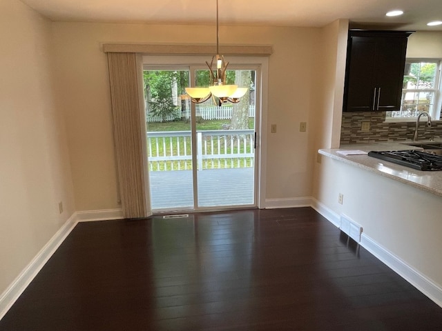 1742 W Gore Rd, Millcreek, PA 16509 - unfurnished dining area featuring dark wood-style floors, a chandelier, and recessed lighting