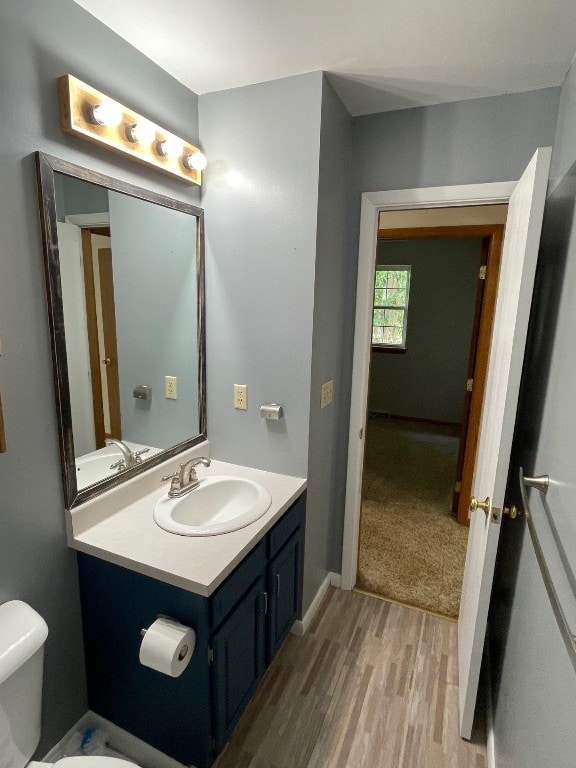 1742 W Gore Rd, Millcreek, PA 16509 - bathroom with wood finished floors and vanity