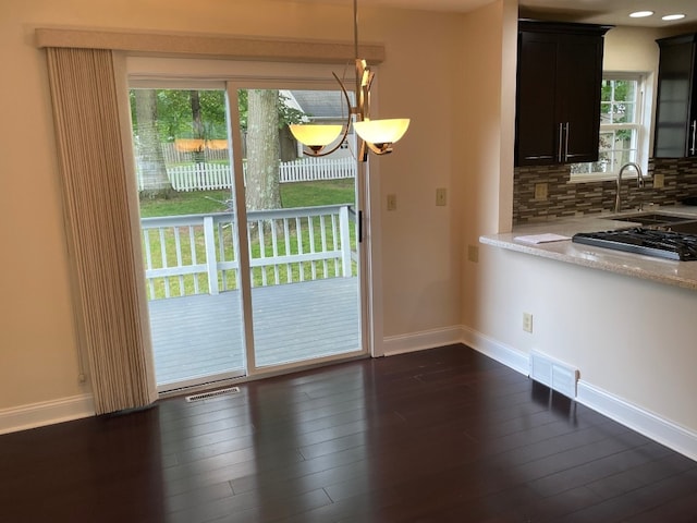 1742 W Gore Rd, Millcreek, PA 16509 - unfurnished dining area featuring baseboards and dark wood-style flooring