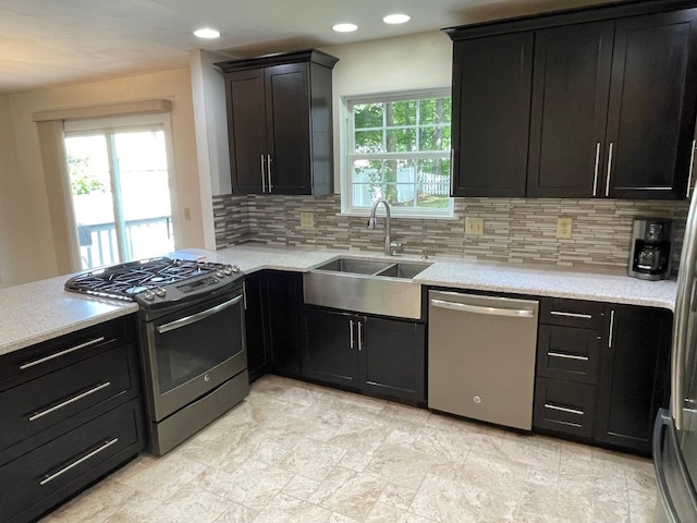 1742 W Gore Rd, Millcreek, PA 16509 - kitchen featuring appliances with stainless steel finishes, tasteful backsplash, recessed lighting, and dark cabinets