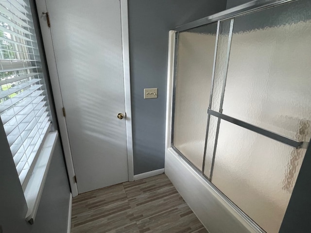 1742 W Gore Rd, Millcreek, PA 16509 - bathroom featuring wood finished floors and bath / shower combo with glass door