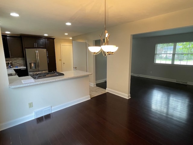 1742 W Gore Rd, Millcreek, PA 16509 - kitchen featuring stainless steel refrigerator with ice dispenser, a peninsula, a chandelier, recessed lighting, and wood finished floors