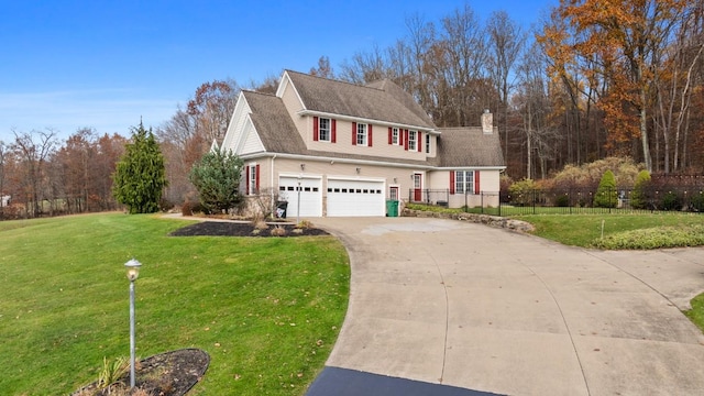 view of front facade with a front yard and a garage