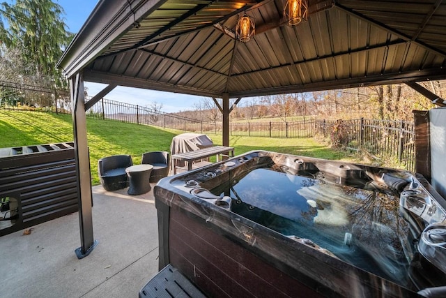 view of patio featuring a gazebo and a hot tub