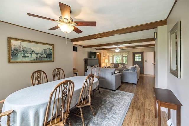 454 Orchard Beach Rd, North East, PA 16428 - dining room featuring a ceiling fan, wood finished floors, beamed ceiling, and baseboard heating