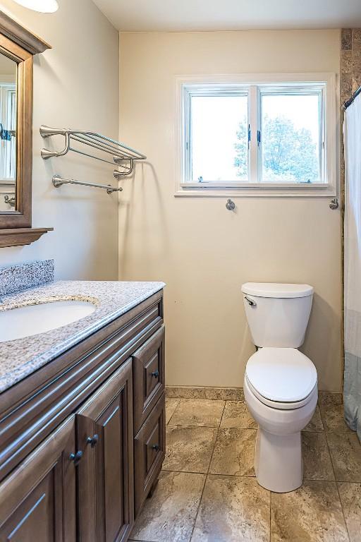 454 Orchard Beach Rd, North East, PA 16428 - bathroom with vanity and a shower with shower curtain