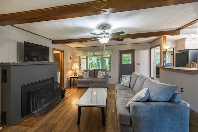 454 Orchard Beach Rd, North East, PA 16428 - living area featuring beamed ceiling, wood finished floors, and a ceiling fan