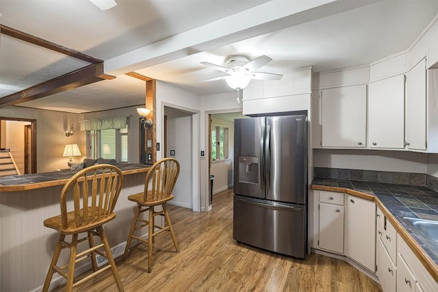 454 Orchard Beach Rd, North East, PA 16428 - kitchen with stainless steel fridge, a kitchen bar, plenty of natural light, and light wood finished floors