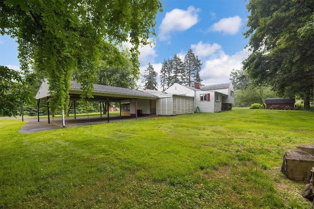 454 Orchard Beach Rd, North East, PA 16428 - view of grassy yard featuring an attached carport