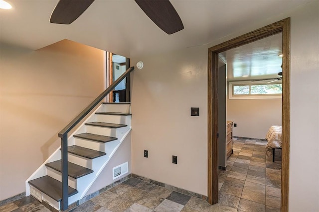 454 Orchard Beach Rd, North East, PA 16428 - stairway with ceiling fan and stone tile floors