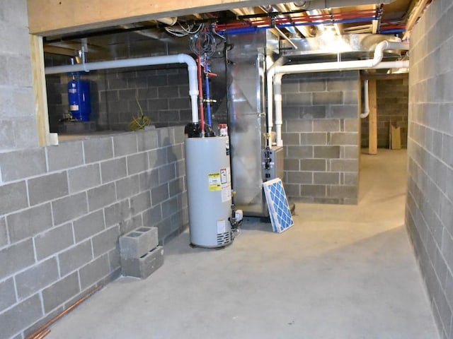 utility room featuring water heater