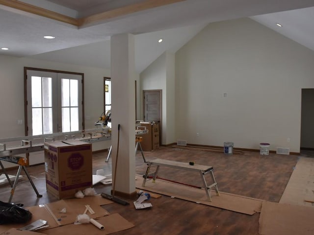 interior space with recessed lighting, visible vents, wood finished floors, high vaulted ceiling, and baseboards