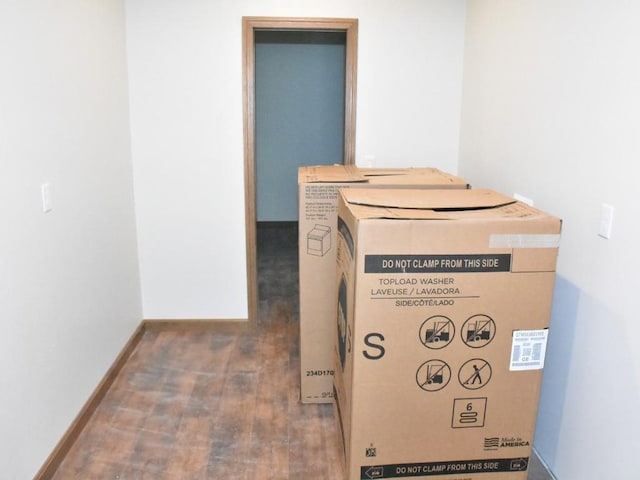 interior details featuring baseboards and wood finished floors