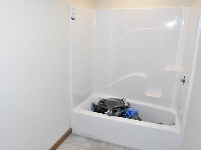 full bathroom featuring baseboards and tile patterned floors