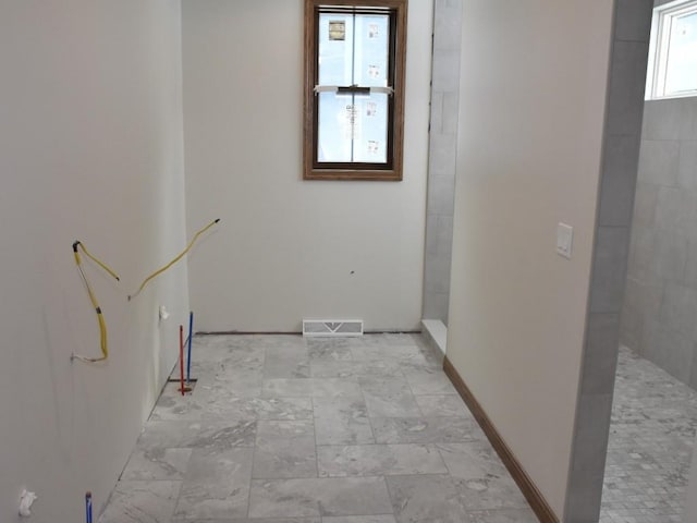 interior space with visible vents and baseboards