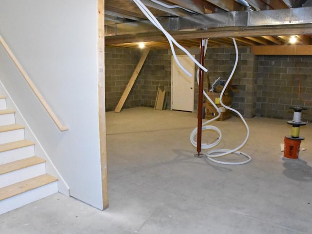 unfinished basement with stairs