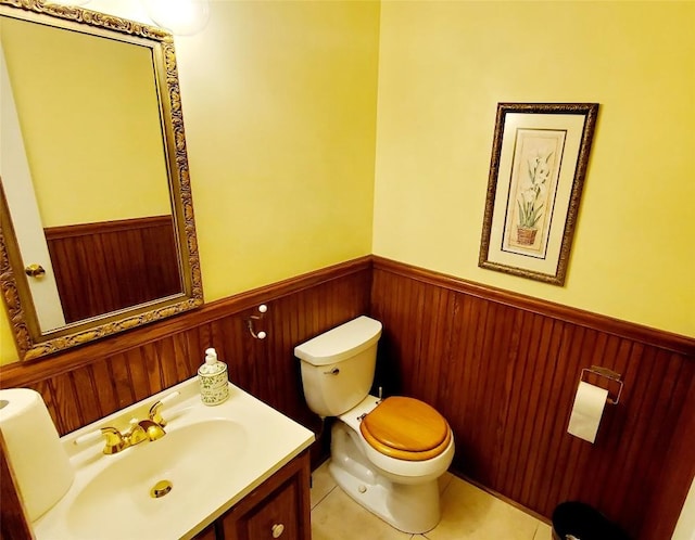 bathroom with tile patterned floors, vanity, and toilet