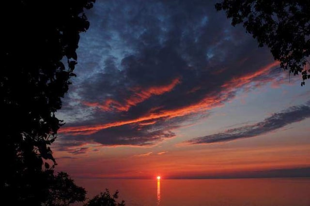 nature at dusk featuring a water view