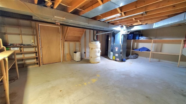 basement featuring heating unit